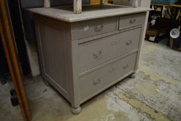 A Continental grey painted pine chest of drawers.