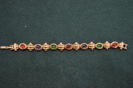 Silver gilt decorative bracelet inset with coloured stones.