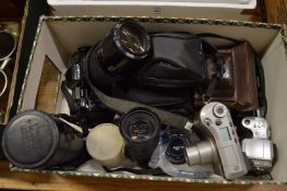 A quantity of cameras and camera equipment.