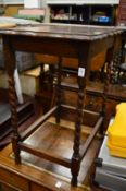 An oak occasional table and a bureau.
