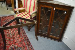 A George III mahogany corner cabinet with stand.