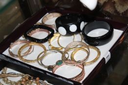 A quantity of decorative bangles.