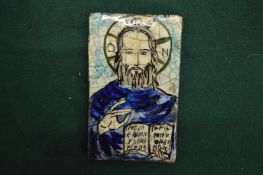 A religious tile plaque.