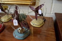 Two early colourful Pifco electric fans.