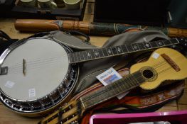 A banjo, a didgeridoo and a Charango.