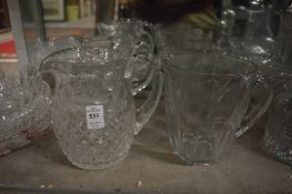 Three glass jugs.