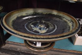 A studio pottery pedestal bowl.