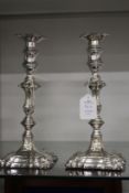 A pair of Georgian design plated candlesticks.