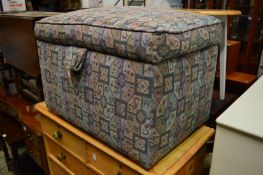 An upholstered ottoman.