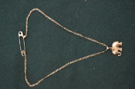 A 14ct gold elephant shaped pendant with chain.