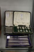 Part set of silver coffee spoons and two sets of silver handled knives.