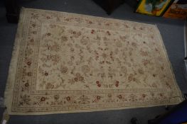 Beige ground carpet with floral decoration, 187cm x 123cm.