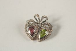 A DIAMOND, PERIDOT AND AMETHYST HEART BROOCH.