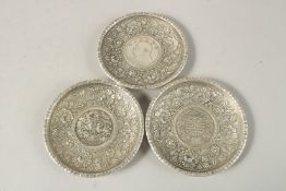 THREE CHINESE CIRCULAR COIN DISHES. 9cms diameter.