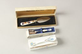 A CROWN DERBY PORCELAIN HANDLED CAKE KNIFE AND TWO SPOONS (3).