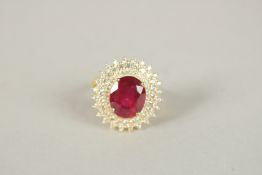 A SILVER GOLD PLATED RUBY CLUSTER RING.