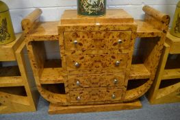 A STYLISH ART DECO BURR WOOD SIDE UNIT with four central drawers flanked by open shelves.