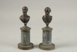 A PAIR OF GRAND TOUR BRONZE BUSTS of men on marble bases. 19cms high.
