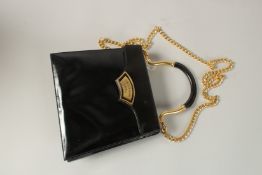 A BLACK PATENT LEATHER CAIRO BAG. 22cms wide.