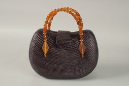 L. K. BENNETT, A BLUE HESSIAN BAG with AMBER HANDLES. 25cms wide.