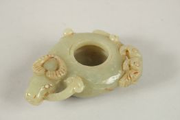 A CARVED JADE BRUSH WASHER.