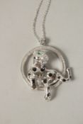 A SILVER PANTHER INA RING, PENDANT AND CHAIN.