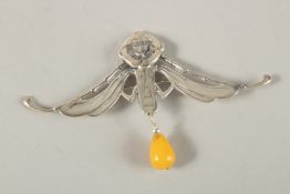 A SILVER AMBER DROP BROOCH.