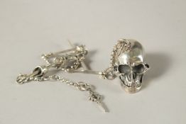 A SILVER SKULL AND CHAIN.