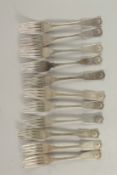A SET OF ELEVEN GEORGE III FIDDLE AND SHELL PATTERN DESSERT FORKS. Edinburgh 1816, maker; A. H.,