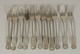 A SET OF ELEVEN GEORGE III FIDDLE AND SHELL PATTERN DESSERT FORKS. Edinburgh 1826, maker: A. H.,