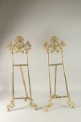 A LARGE PAIR OF GILT METAL EASELS. 80cms high.