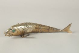 ALRGE GILDED METAL FLEXIBLE FISH with coloured stone eyes. 27cms long.