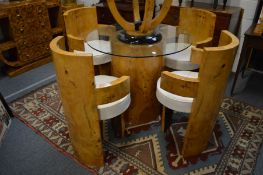 A GOOD ART DECO STYLE DINING SUITE COMPRISING A PEDESTAL GLASS TOP TABLE with a set of four burr