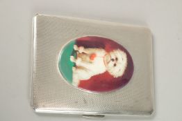 A SILVER ENGINE TURNED CIGARETTE CASE, Birmingham 1941, with an oval plaque of a dog.