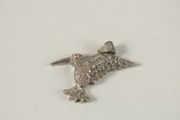 A DIAMOND SET BIRD PENDANT. 4cms long.