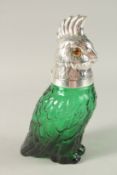 A GREEN GLASS AND SILVER PLATE NOVELTY COCKATOO CLARET JUG. 26cms high.