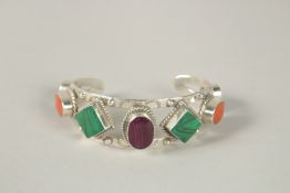 A SILVER BRACELET SET WITH VARIOUS HARDSTONES.