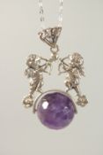 A SILVER AMETHYST SET CHERUB SWIVEL PENDANT AND CHAIN.