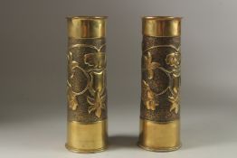 A PAIR OF FIRST WORLD WAR TRENCH ART BRASS SHELL CASES. 30cms high.