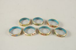SEVEN CLOISONNE ENAMEL RINGS.