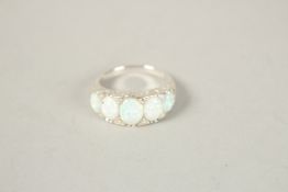 A SILVER FIVE STONE OPAL RING. Ring size (P).