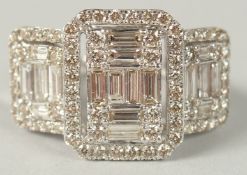 A LARGE TRIPLE CLUSTER RING SET WITH BAGUETTE AND RBC DIAMONDS set in 9ct white gold. Boxed Diamonds