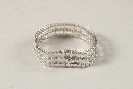 A GOOD 18CT WHITE GOLD AND DIAMOND THREE ROW BRACELET.