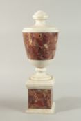 A GOOD ADAM DESIGN WHITE MARBLE URN with coloured marble veins on a pedestal base. 15cm high.