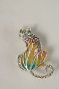 A SILVER PLIQUE ENAMEL CAT BROOCH with ruby eyes.