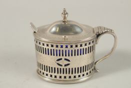A GEORGE III SILVER OVAL MUSTARD POT with sapphire blue liner.