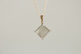 A 9CT GOLD DIAMOND PENDANT ON A CHAIN.