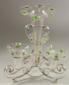 AN ART NOUVEAU COLUMN GLASS TABLE CENTREPIECE with a silver plated stand and four trumpet vases.