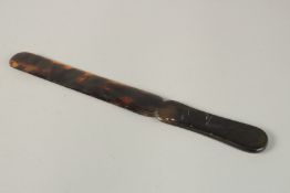 A TORTOISESHELL PAPER KNIFE. 27cms long.