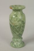 A MARBLE URN. 23cms high.